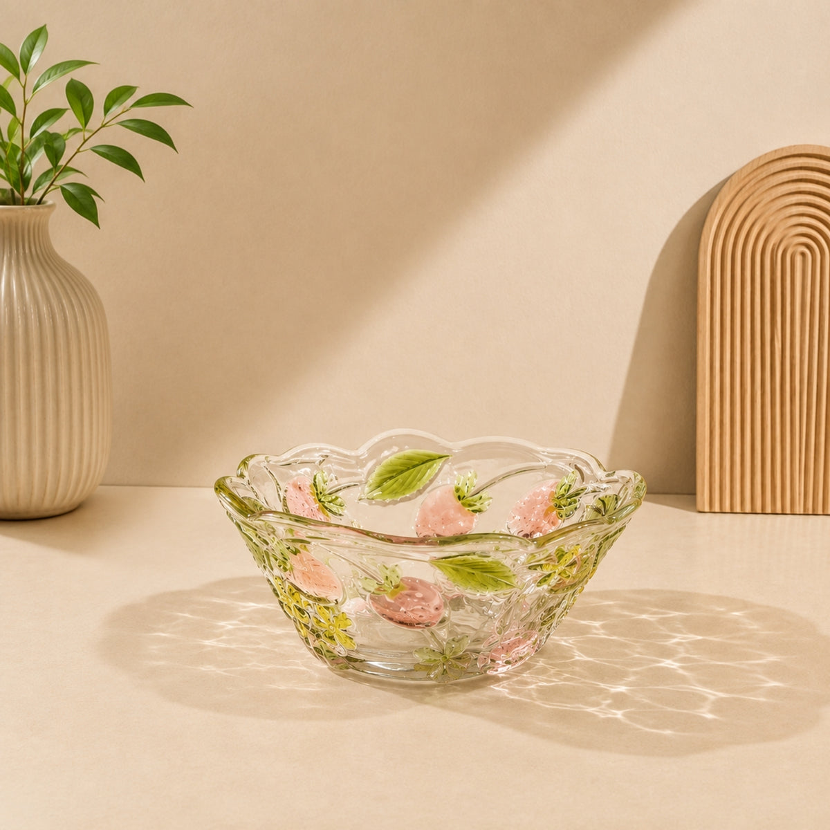 Strawberry embossed clear glass serving bowl with pink strawberries green leaves and decorative scalloped rim