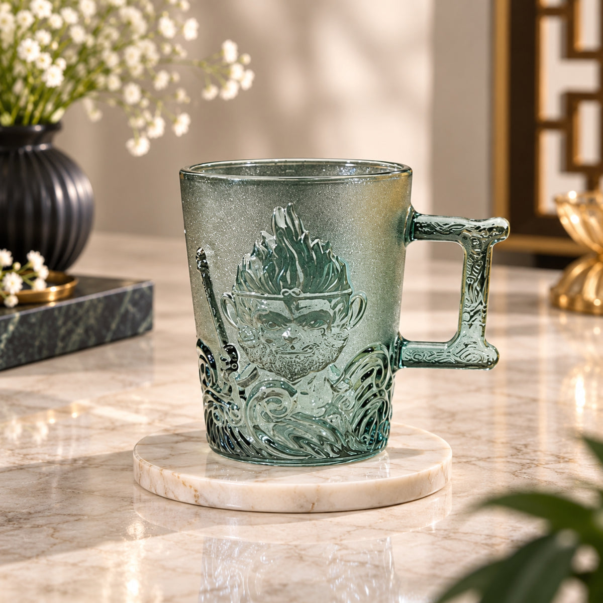 Wukong green embossed glass cup with raised character design, wave detailing and decorative handle