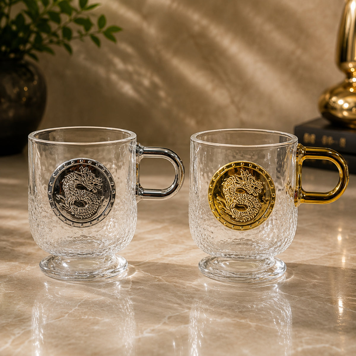 Dragon glass cup 2-piece set with textured clear glass and gold and silver dragon medallion designs