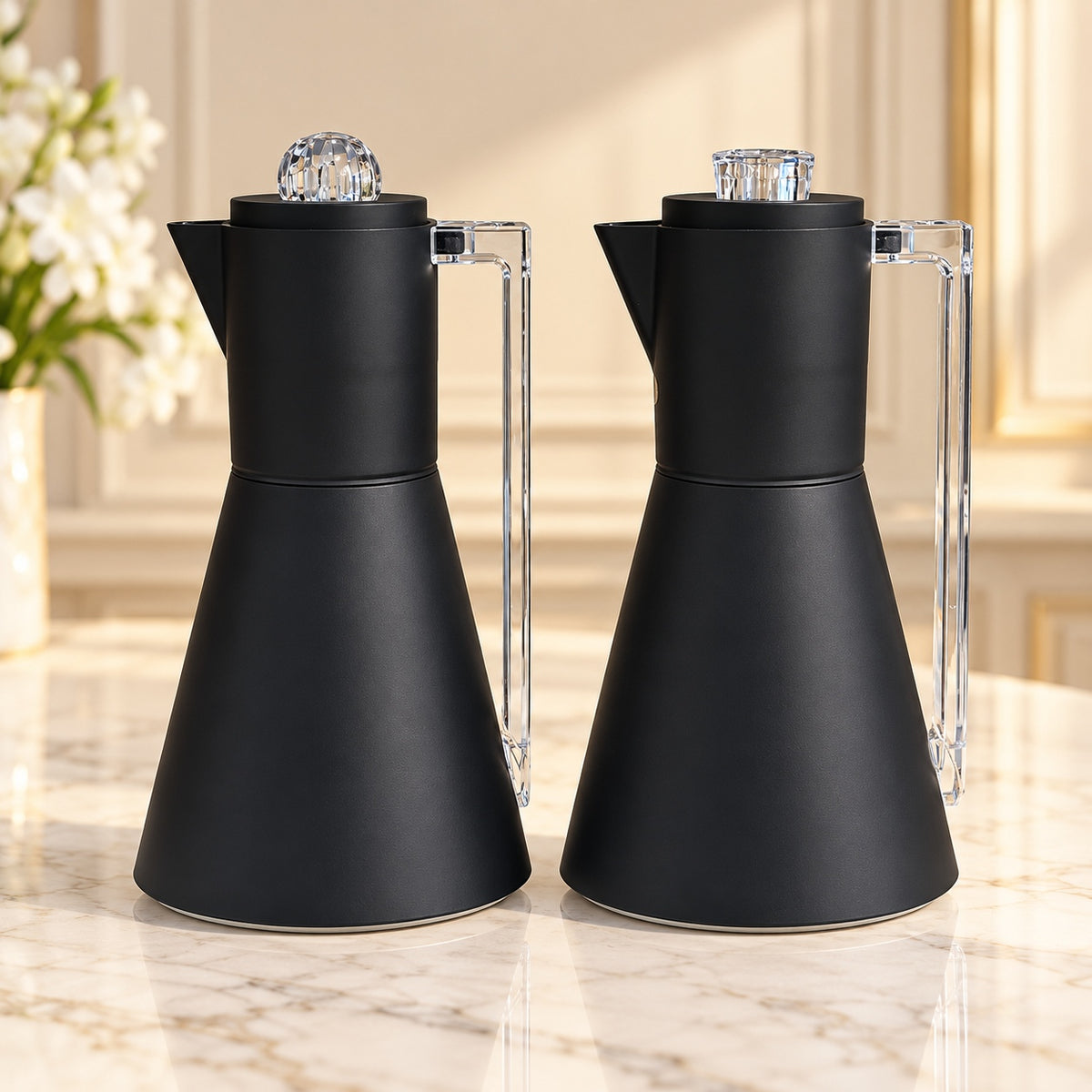 Najib luxury matte black 2-piece vacuum flask set, 1L + 1L, featuring modern conical bodies, transparent crystal-style handles and decorative clear lid knobs.