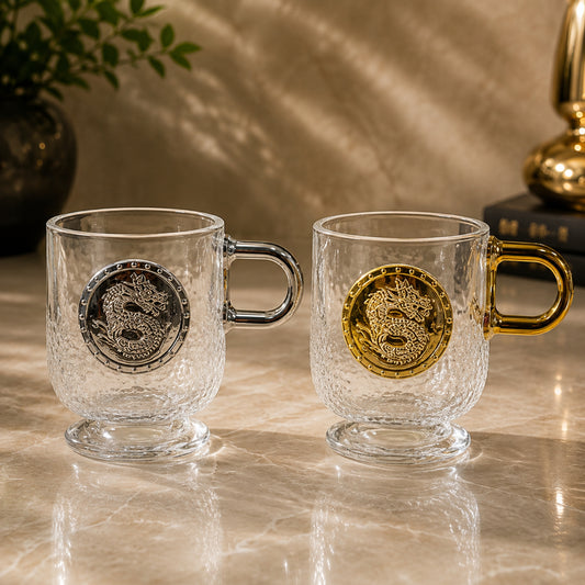 Dragon glass cup 2-piece set with textured clear glass and gold and silver dragon medallion designs