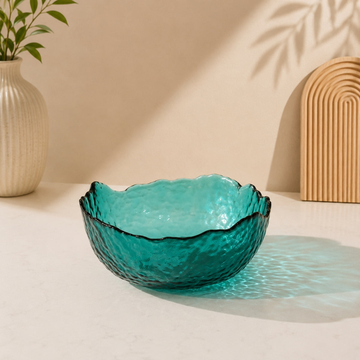 Emerald green textured glass serving bowl with decorative wavy rim single piece